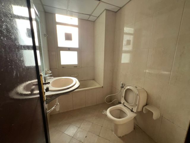 A 2-bedroom apartment with a living room in Al Khan area.